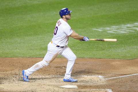 Sep 22, 2020; New York City, New York, USA; New York Mets first baseman Pete Alonso (20) follows through on a solo home run against the Tampa Bay Rays during the fourth inning at Citi Field. Mandatory Credit: Brad Penner-USA TODAY Sports