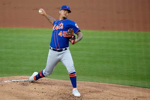 Mar 13, 2021; West Palm Beach, Florida, USA; New York Mets pitcher Jordan Yamamoto (45) throws against the Washington Nationals during the first inning of a spring training game at FITTEAM Ballpark of the Palm Beaches. Mandatory Credit: Rhona Wise-USA TODAY Sports