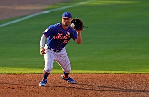 Mar 26, 2021; Port St. Lucie, Florida, USA; New York Mets third baseman J.D. Davis (28) fields the ground ball before throwing out Washington Nationals shortstop Trea Turner (7, not pictured) in the 1st inning of the spring training game at Clover Park. Mandatory Credit: Jasen Vinlove-USA TODAY Sports