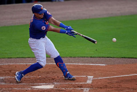 Mar 26, 2021; Port St. Lucie, Florida, USA; New York Mets catcher James McCann (33) singles in a run in the 2nd inning of the spring training game against the Washington Nationals at Clover Park. Mandatory Credit: Jasen Vinlove-USA TODAY Sports