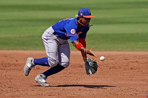 Mar 28, 2021; Jupiter, Florida, USA; New York Mets shortstop Francisco Lindor (12) flips the ball to second base to get the force out of Miami Marlins catcher Jorge Alfaro (38, not pictured) in the 4th inning of the spring training game at Roger Dean Chevrolet Stadium. Mandatory Credit: Jasen Vinlove-USA TODAY Sports