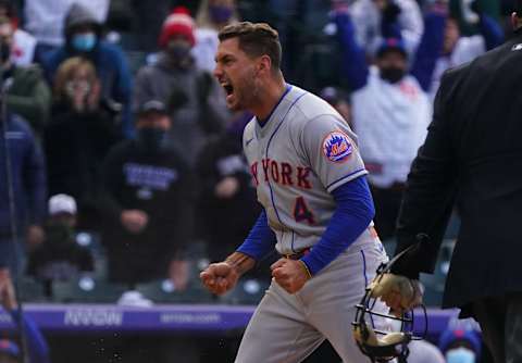 Apr 17, 2021; Denver, Colorado, USA; New York Mets center fielder Albert Almora Jr. (4) celebrates scoring the game tying run in the seventh inning against the Colorado Rockies at Coors Field. Mandatory Credit: Ron Chenoy-USA TODAY Sports