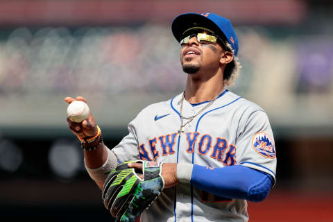 Apr 18, 2021; Denver, Colorado, USA; New York Mets shortstop Francisco Lindor (12) throws the ball into the stands in the fifth inning against the Colorado Rockies at Coors Field. Mandatory Credit: Isaiah J. Downing-USA TODAY Sports