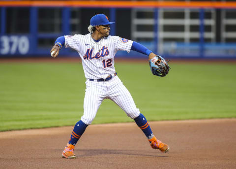 Apr 27, 2021; New York City, New York, USA; New York Mets shortstop Francisco Lindor (12) throws to first base for an out to end the top of the first inning against the Boston Red Sox at Citi Field. Mandatory Credit: Wendell Cruz-USA TODAY Sports