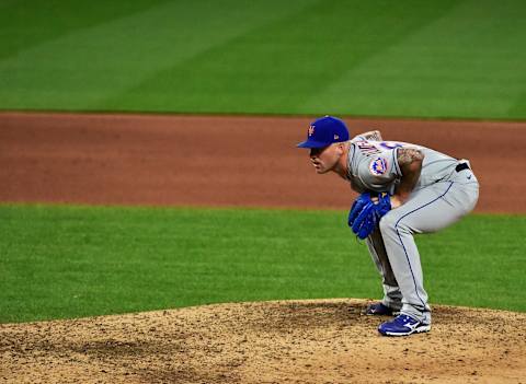 May 3, 2021; St. Louis, Missouri, USA; New York Mets relief pitcher Sean Reid-Foley (61) reads the signs prior to a pitch during the sixth inning against the St. Louis Cardinals at Busch Stadium. Mandatory Credit: Jeff Curry-USA TODAY Sports