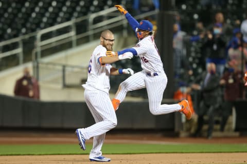 May 11, 2021; New York City, New York, USA; New York Mets pinch hitter Patrick Mazeika (L) is congratulated by shortstop Francisco Lindor (12) after a walk-off fielders choice during the bottom of the ninth inning against the Baltimore Orioles at Citi Field. Mandatory Credit: Brad Penner-USA TODAY Sports