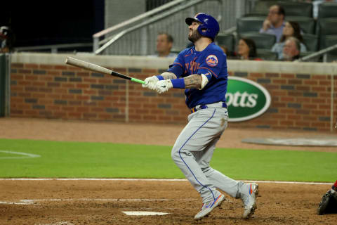 May 18, 2021; Atlanta, Georgia, USA; New York Mets catcher Tomas Nido (3) hits a solo home run during the ninth inning against the Atlanta Braves at Truist Park. Mandatory Credit: Jason Getz-USA TODAY Sports