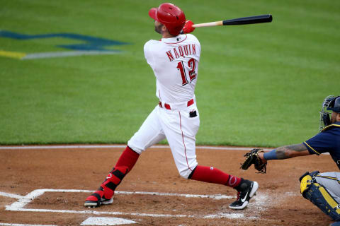 Cincinnati Reds center fielder Tyler Naquin (12) hits a three-run home run in the first inning during a baseball game against the Milwaukee Brewers, Friday, May 21, 2021, at Great American Ball Park in Cincinnati.Milwaukee Brewers At Cincinnati Reds May 21