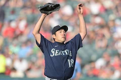 Jun 12, 2021; Cleveland, Ohio, USA; Seattle Mariners starting pitcher Yusei Kikuchi (18) stretches during the seventh inning against the Cleveland Indians at Progressive Field. Mandatory Credit: Ken Blaze-USA TODAY Sports