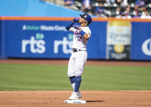 Jun 25, 2021; New York City, New York, USA; New York Mets shortstop Francisco Lindor (12) stops at second base after hitting a double in the first inning against the Philadelphia Phillies at Citi Field. Mandatory Credit: Wendell Cruz-USA TODAY Sports