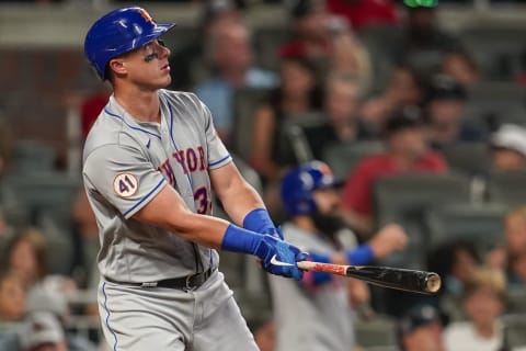 Jun 29, 2021; Cumberland, Georgia, USA; New York Mets catcher James McCann (33) watches after hitting a threeun home run against the Atlanta Braves during the seventh inning at Truist Park. Mandatory Credit: Dale Zanine-USA TODAY Sports