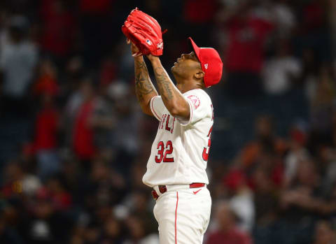 Jul 3, 2021; Anaheim, California, USA; Los Angeles Angels relief pitcher Raisel Iglesias (32) celebrates the 4-1 victory against the Baltimore Orioles at Angel Stadium. Mandatory Credit: Gary A. Vasquez-USA TODAY Sports