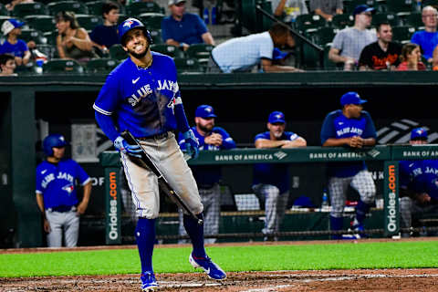 Jul 6, 2021; Baltimore, Maryland, USA; Toronto Blue Jays center fielder George Springer (4) reacts after a swing during an eighth inning at bat against the Baltimore Orioles at Oriole Park at Camden Yards. Mandatory Credit: Tommy Gilligan-USA TODAY Sports