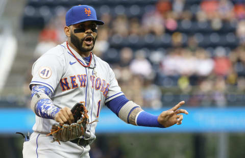 Jul 16, 2021; Pittsburgh, Pennsylvania, USA; New York Mets third baseman Jonathan Villar (1) gestures to the Pittsburgh Pirates dugout during the first inning at PNC Park. Mandatory Credit: Charles LeClaire-USA TODAY Sports