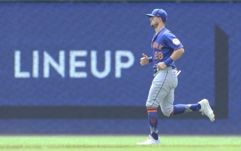 Jul 18, 2021; Pittsburgh, Pennsylvania, USA; New York Mets third baseman J.D. Davis warms up in the outfield before playing the Pittsburgh Pirates at PNC Park. Mandatory Credit: Charles LeClaire-USA TODAY Sports