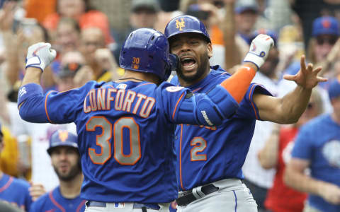 Jul 18, 2021; Pittsburgh, Pennsylvania, USA; New York Mets right fielder Michael Conforto (30) celebrates with left fielder Dominic Smith (2) after hitting a two-run home run against the Pittsburgh Pirates during the ninth inning at PNC Park. Mandatory Credit: Charles LeClaire-USA TODAY Sports