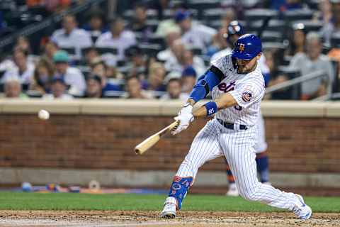 Jul 26, 2021; New York City, New York, USA; New York Mets right fielder Michael Conforto (30) hits a single during the fourth inning against the Atlanta Braves at Citi Field. Mandatory Credit: Vincent Carchietta-USA TODAY Sports