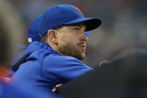 Jul 27, 2021; New York City, New York, USA; New York Mets injured starting pitcher Jacob deGrom (48) watches from the dugout during the third inning against the Atlanta Braves at Citi Field. Mandatory Credit: Brad Penner-USA TODAY Sports