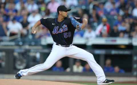 Jul 30, 2021; New York City, New York, USA; New York Mets starting pitcher Carlos Carrasco (59) pitches against the Cincinnati Reds during the first inning at Citi Field. Mandatory Credit: Brad Penner-USA TODAY Sports