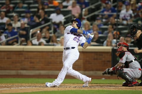 Jul 31, 2021; New York City, New York, USA; New York Mets shortstop Javier Baez (23) follows through on a two-run home run against the Cincinnati Reds during the sixth inning at Citi Field. Mandatory Credit: Brad Penner-USA TODAY Sports