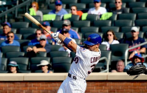 Aug 11, 2021; New York, New York, USA; New York Mets right fielder Michael Conforto (30) singles against the Washington Nationals during the third inning at Citi Field Mandatory Credit: Andy Marlin-USA TODAY Sports