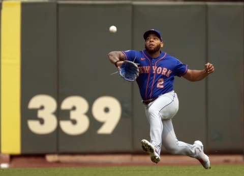 Aug 18, 2021; San Francisco, California, USA; New York Mets left fielder Dominic Smith (2) makes a sliding catch off a shallow popup off the bat of San Francisco Giants shortstop Brandon Crawford during the second inning at Oracle Park. Mandatory Credit: D. Ross Cameron-USA TODAY Sports