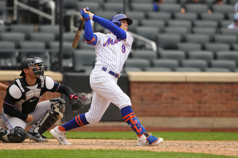 Aug 31, 2021; New York City, New York, USA; New York Mets center fielder Brandon Nimmo (9) hits a two run home run during the ninth inning against the Miami Marlins at Citi Field. Mandatory Credit: Gregory Fisher-USA TODAY Sports