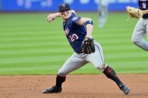 Sep 9, 2021; Cleveland, Ohio, USA; Minnesota Twins third baseman Josh Donaldson (20) throws to first base against the Cleveland Indians in the second inning at Progressive Field. Mandatory Credit: David Richard-USA TODAY Sports