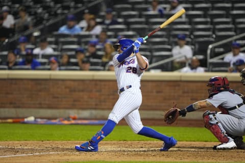 Sep 13, 2021; New York City, New York, USA; New York Mets third baseman J.D. Davis (28) hits a single during the seventh inning against the St. Louis Cardinals at Citi Field. Mandatory Credit: Gregory Fisher-USA TODAY Sports