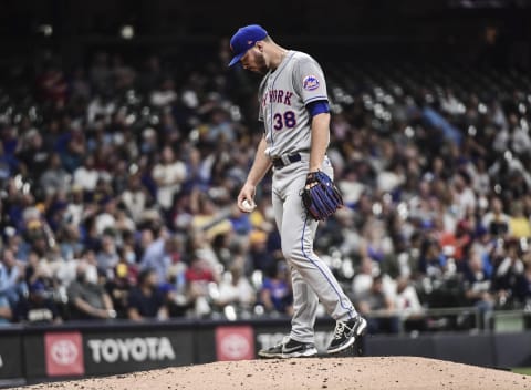 Sep 24, 2021; Milwaukee, Wisconsin, USA; New York Mets pitcher Tylor Megill (38) reacts after giving up back-to-back home runs in the third inning against the Milwaukee Brewers at American Family Field. Mandatory Credit: Benny Sieu-USA TODAY Sports