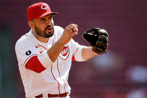 Cincinnati Reds third baseman Eugenio Suarez (7) winces as he reenacts a pop fly play that ended to second inning to the Pirates dugout in the top fo the third inning of the MLB National League game between the Cincinnati Reds and the Pittsburgh Pirates at Great American Ball Park in downtown Cincinnati on Monday, Sept. 27, 2021. The Reds led 8-1 in the top of the sixth inning.Pittsburgh Pirates At Cincinnati Reds