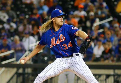 Sep 28, 2021; New York City, New York, USA; New York Mets starting pitcher Noah Syndergaard (34) throws against the Miami Marlins during the first inning of game two of a doubleheader at Citi Field. Mandatory Credit: Andy Marlin-USA TODAY Sports