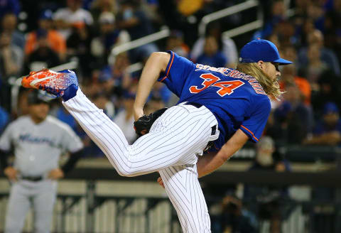 Sep 28, 2021; New York City, New York, USA; New York Mets starting pitcher Noah Syndergaard (34) throws against the Miami Marlins during the first inning of game two of a doubleheader at Citi Field. Mandatory Credit: Andy Marlin-USA TODAY Sports