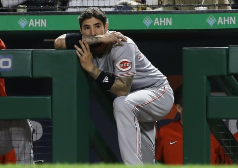 Oct 2, 2021; Pittsburgh, Pennsylvania, USA; Cincinnati Reds right fielder Nick Castellanos (2) looks on from the dugout against the Pittsburgh Pirates during the sixth inning at PNC Park. The Pirates won 8-6. Mandatory Credit: Charles LeClaire-USA TODAY Sports