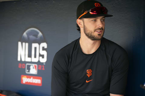 Oct 7, 2021; San Francisco, CA, USA; San Francisco Giants outfielder Kris Bryant (23) conducts an interview in the dugout during NLDS workouts. Mandatory Credit: D. Ross Cameron-USA TODAY Sports