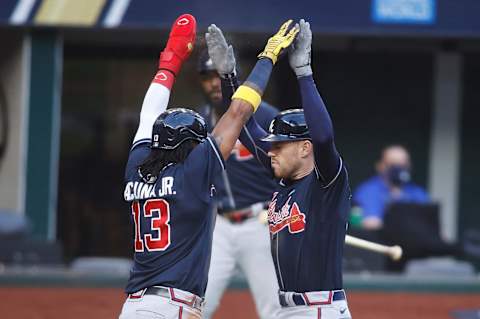 Oct 13, 2020; Arlington, Texas, USA; Atlanta Braves first baseman Freddie Freeman (5) is celebrates with right fielder Ronald Acuna Jr. (13) after hitting a two run home run during the fourth inning against the Los Angeles Dodgers in game two of the 2020 NLCS at Globe Life Field. Mandatory Credit: Tim Heitman-USA TODAY Sports