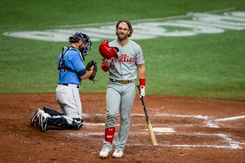 Sep 27, 2020; St. Petersburg, Florida, USA; Philadelphia Phillies designated hitter Bryce Harper (3) laughs at a strike call during the final regular season game between the Tampa Bay Rays and the Philadelphia Phillies at Tropicana Field. Mandatory Credit: Mary Holt-USA TODAY Sports