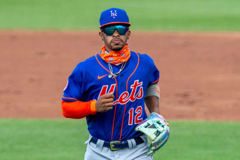 Mar 1, 2021; Jupiter, Florida, USA; New York Mets shortstop Francisco Lindor (12) returns to the dugout against the Miami Marlins at Roger Dean Chevrolet Stadium. Mandatory Credit: Sam Navarro-USA TODAY Sports