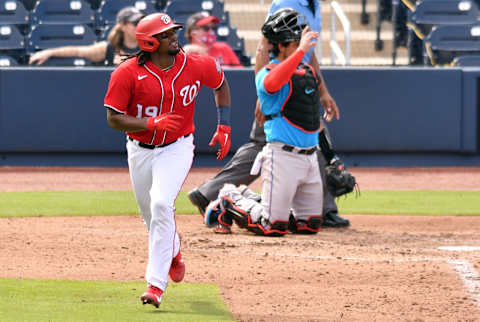 Mar 3, 2021; West Palm Beach, Florida, USA; Washington Nationals first baseman Josh Bell (19) watches his home run leave the park in the fourth inning against the Miami Marlins during a spring training game at Ballpark of the Palm Beaches. Mandatory Credit: Jim Rassol-USA TODAY Sports