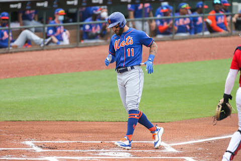 Mar 3, 2021; Jupiter, Florida, USA; New York Mets center fielder Kevin Pillar (11) scores a run against the St. Louis Cardinals in the first inning at Roger Dean Chevrolet Stadium. Mandatory Credit: Sam Navarro-USA TODAY Sports