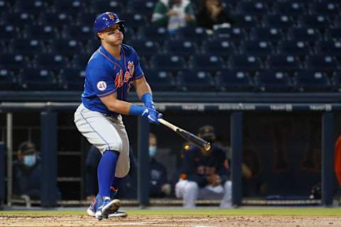 Mar 11, 2021; West Palm Beach, Florida, USA; New York Mets catcher James McCann (33) bats during the third inning of a spring training game against the Houston Astros at FITTEAM Ballpark of the Palm Beaches. Mandatory Credit: Rhona Wise-USA TODAY Sports