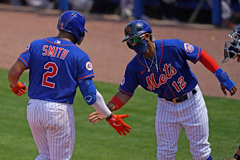 Mar 16, 2021; Port St. Lucie, Florida, USA; New York Mets left fielder Dominic Smith (2) celebrates with shortstop Francisco Lindor (12) after hitting a three-run homerun in the 3rd inning of the spring training game against the Houston Astros at Clover Park. Mandatory Credit: Jasen Vinlove-USA TODAY Sports