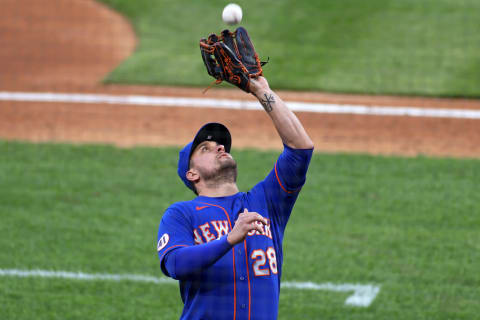 May 1, 2021; Philadelphia, Pennsylvania, USA; New York Mets third baseman J.D. Davis (28) catches a fly ball against the Philadelphia Phillies in the third inning at Citizens Bank Park. Mandatory Credit: Kam Nedd-USA TODAY Sports