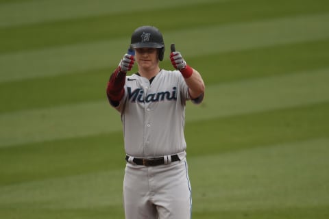 May 16, 2021; Los Angeles, California, USA; Miami Marlins first baseman Garrett Cooper (26) reacts after reaching second base during the first inning against the Los Angeles Dodgers at Dodger Stadium. Mandatory Credit: Kelvin Kuo-USA TODAY Sports