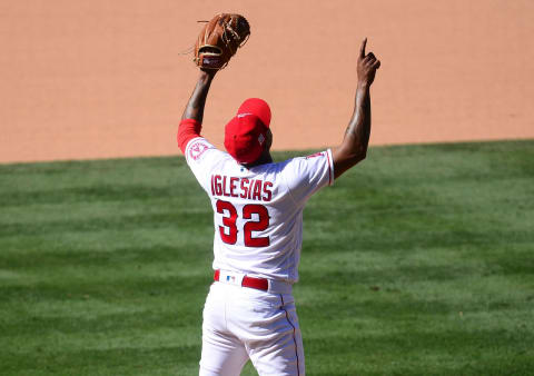 May 23, 2021; Anaheim, California, USA; Los Angeles Angels relief pitcher Raisel Iglesias (32) celebrtes the 6-5 victory against the Oakland Athletics at Angel Stadium. Mandatory Credit: Gary A. Vasquez-USA TODAY Sports