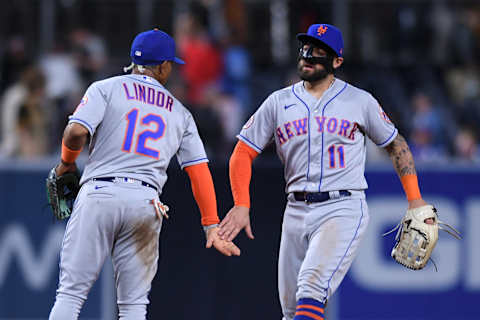 Jun 5, 2021; San Diego, California, USA; New York Mets shortstop Francisco Lindor (12) and left fielder Kevin Pillar (11) celebrate on the field after defeating the San Diego Padres at Petco Park. Mandatory Credit: Orlando Ramirez-USA TODAY Sports