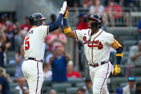 Jun 30, 2021; Atlanta, Georgia, USA; Atlanta Braves right fielder Ronald Acuna Jr. (13) celebrates after a home run with first baseman Freddie Freeman (5) against the New York Mets in the first inning at Truist Park. Mandatory Credit: Brett Davis-USA TODAY Sports