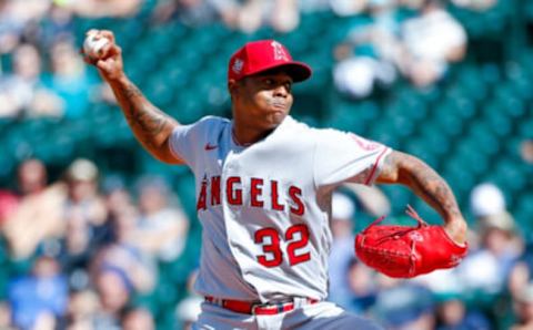 Jul 11, 2021; Seattle, Washington, USA; Los Angeles Angels relief pitcher Raisel Iglesias (32) throws against the Seattle Mariners during the ninth at T-Mobile Park. Mandatory Credit: Jennifer Buchanan-USA TODAY Sports