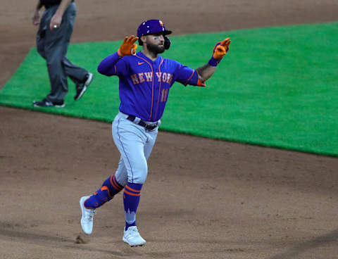 Jul 19, 2021; Cincinnati, Ohio, USA; New York Mets pinch hitter Kevin Pillar (11) reacts after hitting a three-run home run against the Cincinnati Reds during the 11th inning at Great American Ball Park. Mandatory Credit: David Kohl-USA TODAY Sports