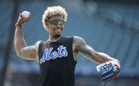 Aug 10, 2021; New York City, New York, USA; New York Mets injured shortstop Francisco Lindor (12) works out on the field before a game against the Washington Nationals at Citi Field. Mandatory Credit: Brad Penner-USA TODAY Sports